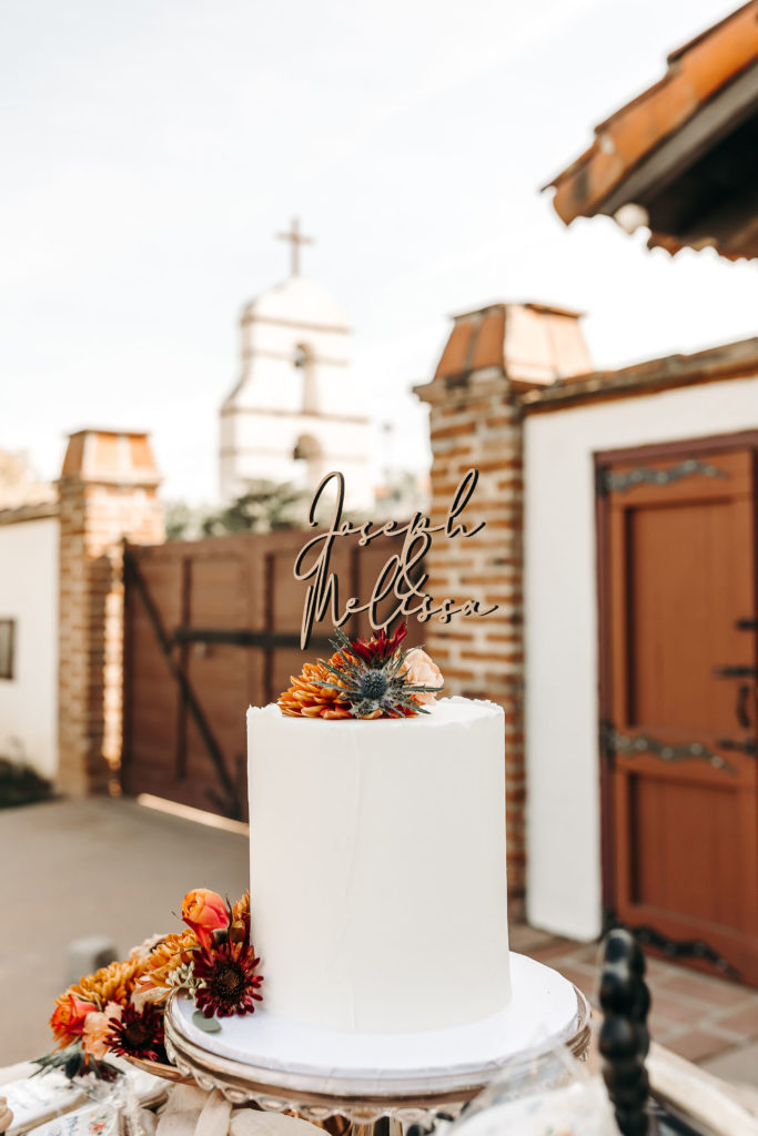 Wedding cake with Asistecia bell tower in the background