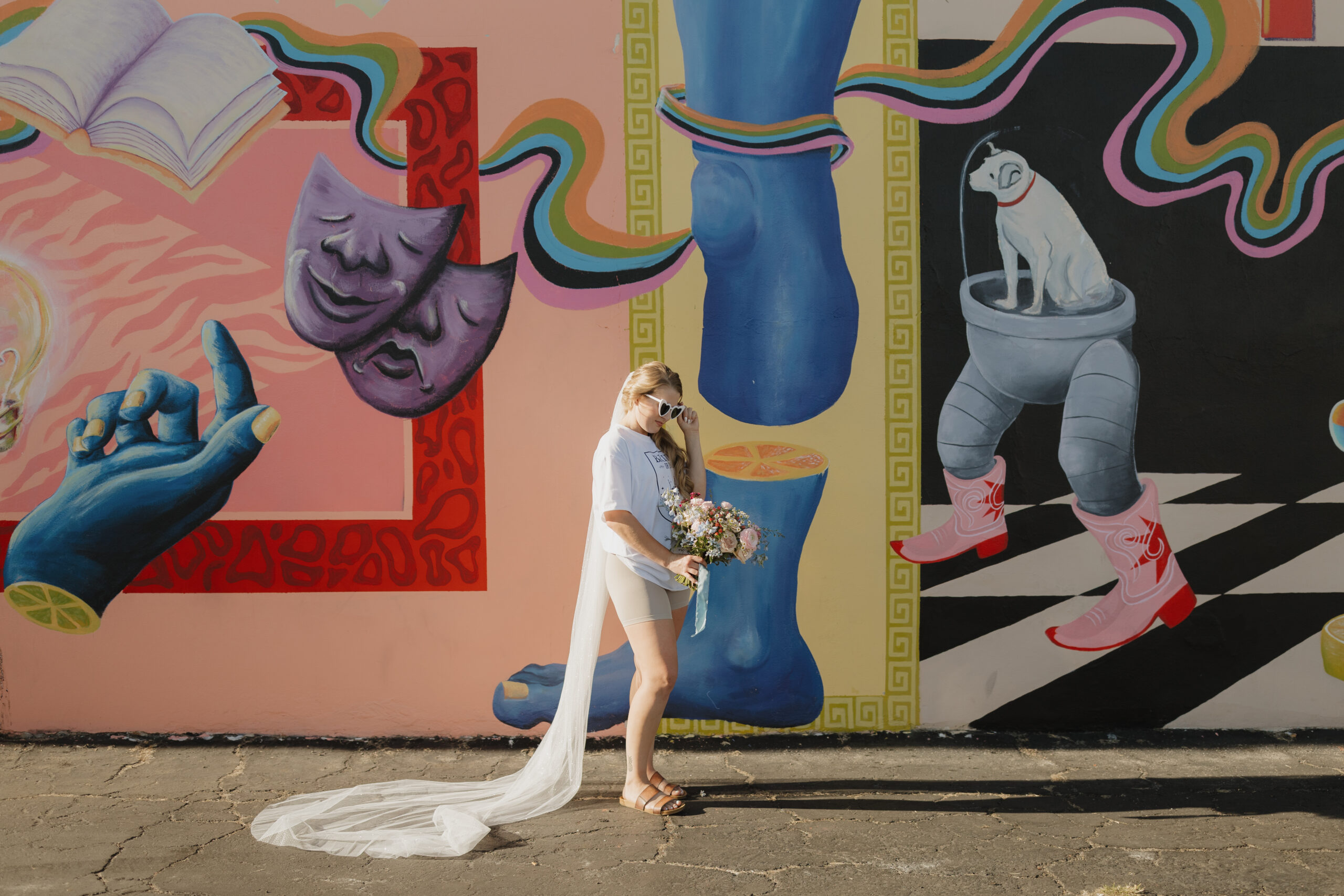 Woman in heart glasses with bouquet