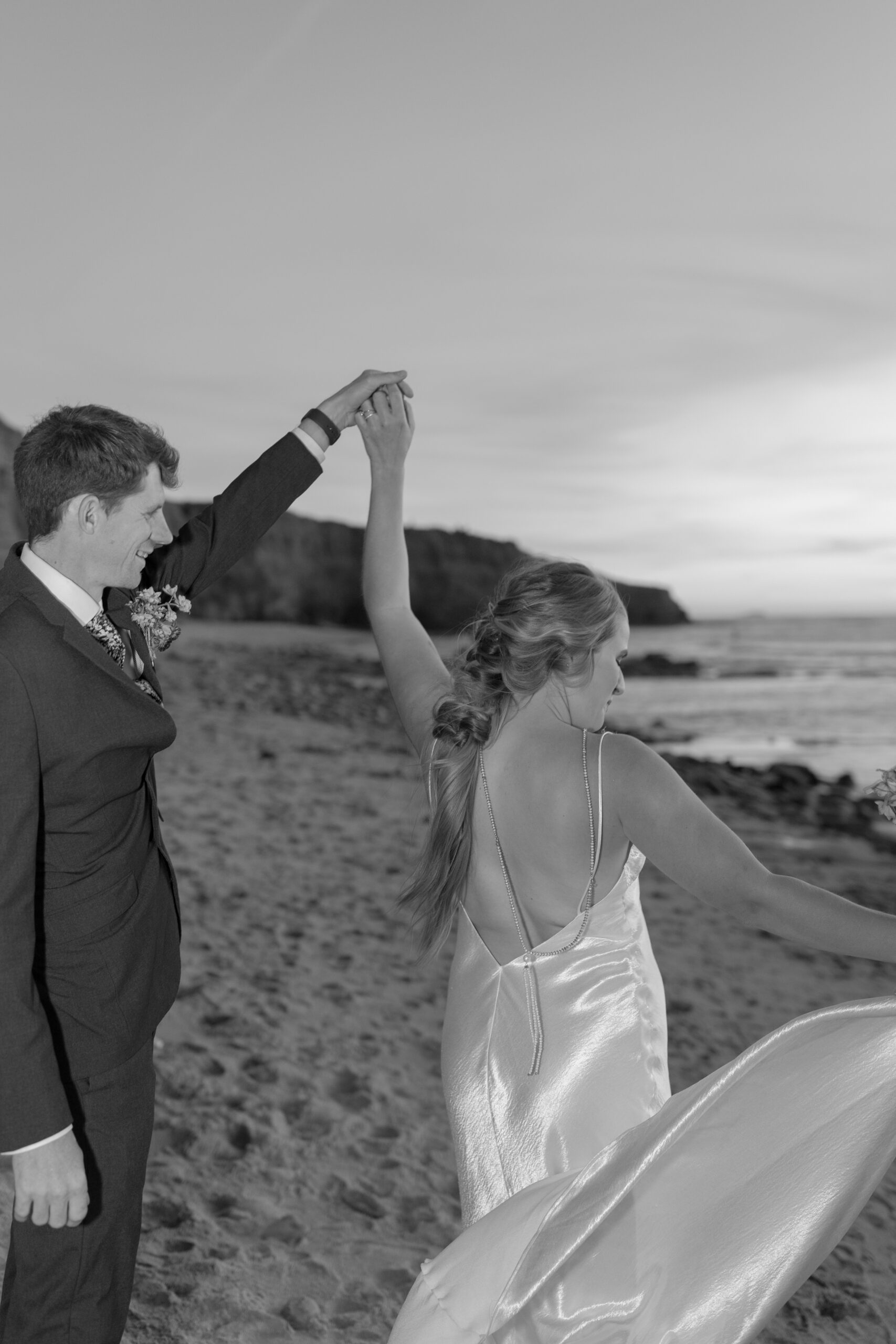 Groom spinning bride