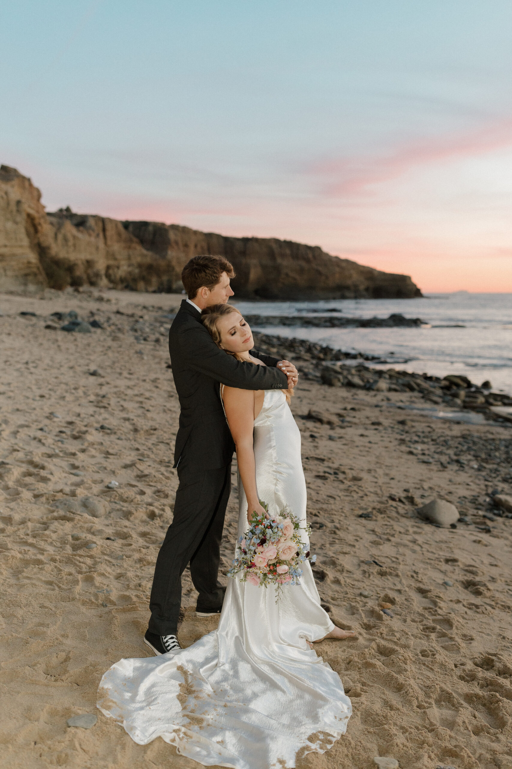 Couple in embrace with sunset in the background