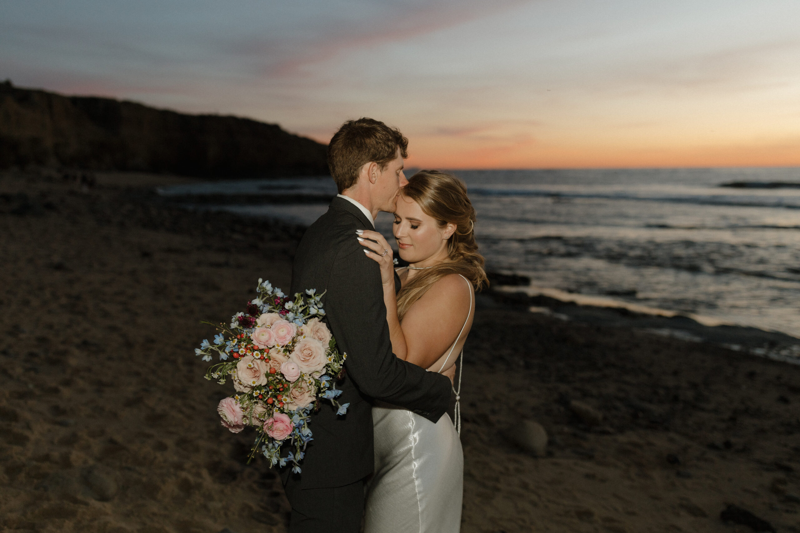 Couple in embrace with sunset in the background