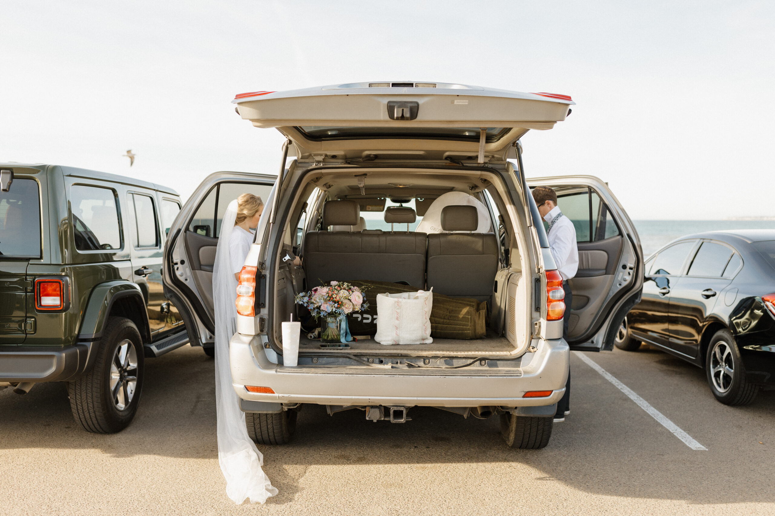 Couple getting ready at their car