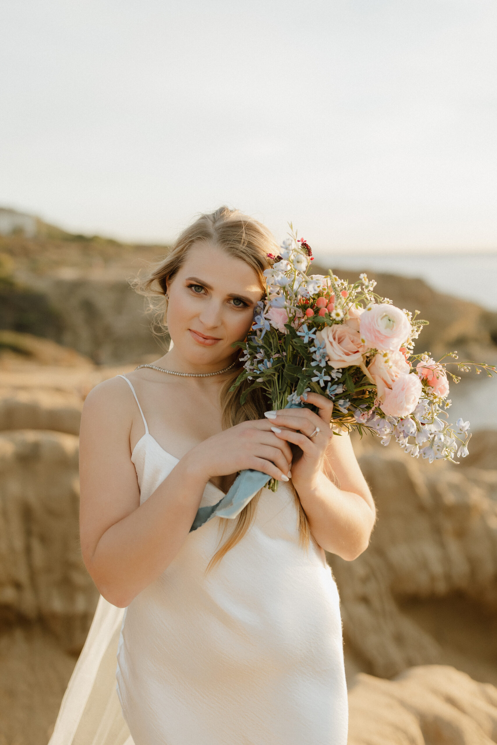 Bride "hugging" her bouquet