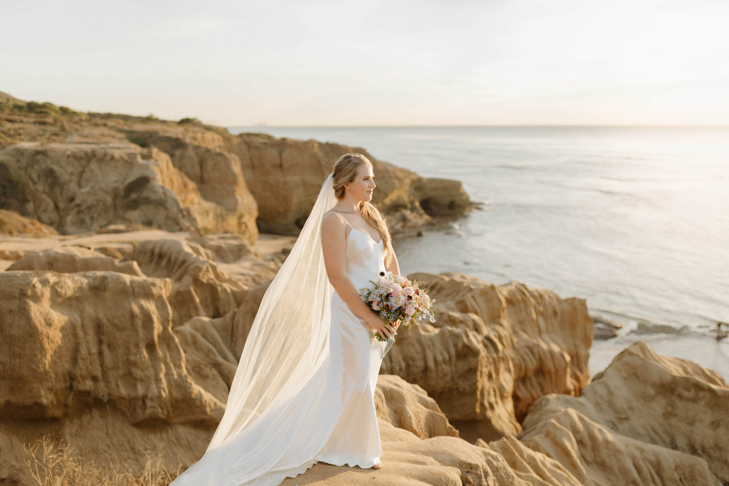 Bride looking out over the ocean