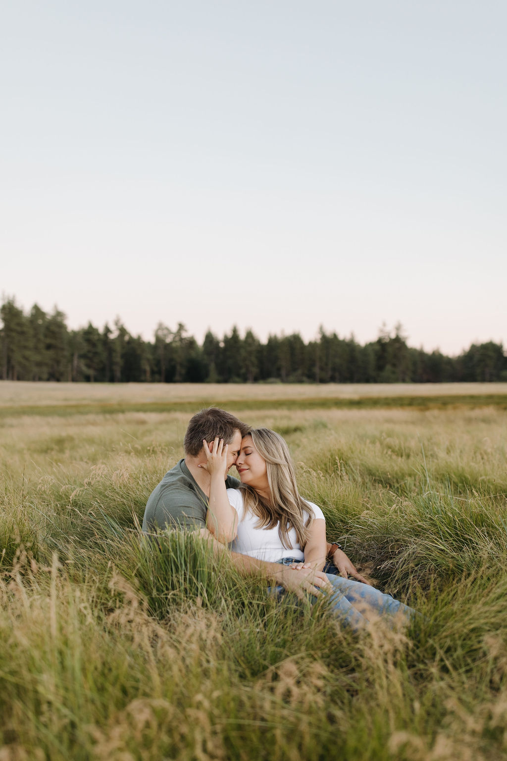 Couple embracing in a field