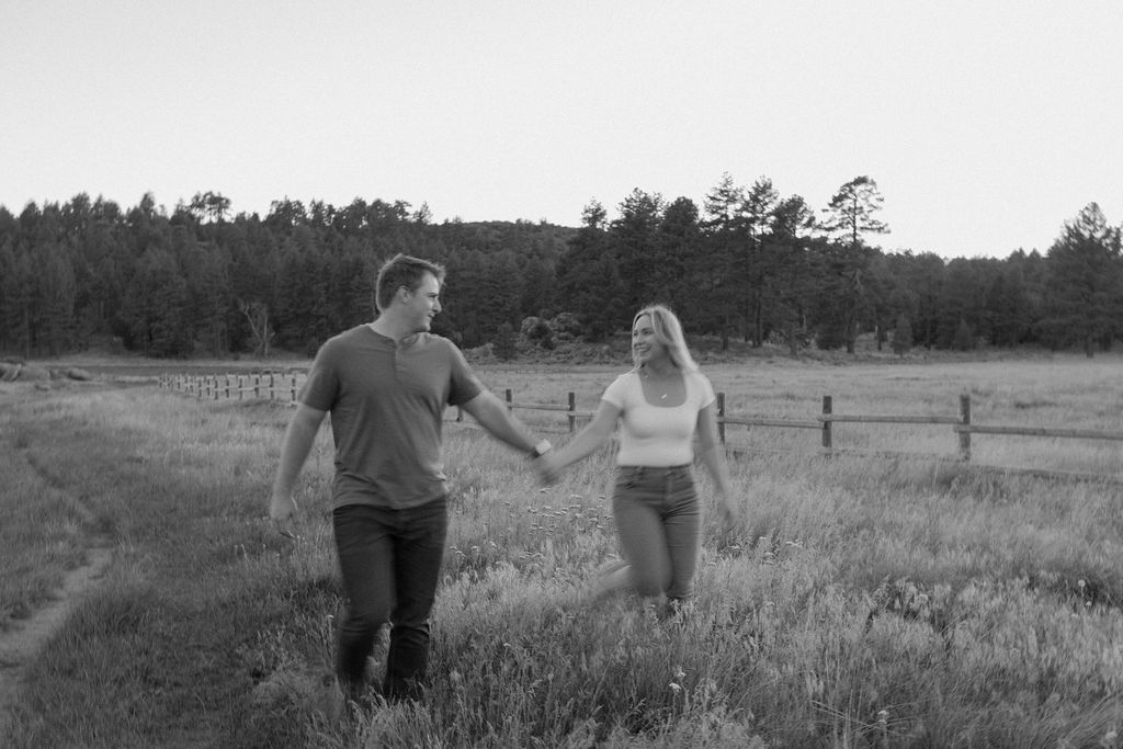 Black and white blurry image of a couple holding hands