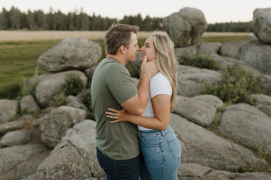 Man holding woman's face in hands