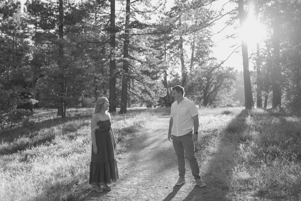 Couple standing in the trees