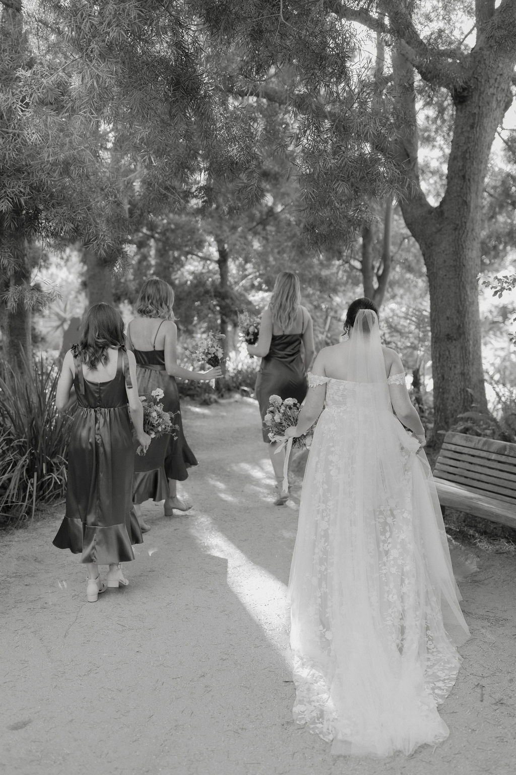 Bride and bridesmaids walking 