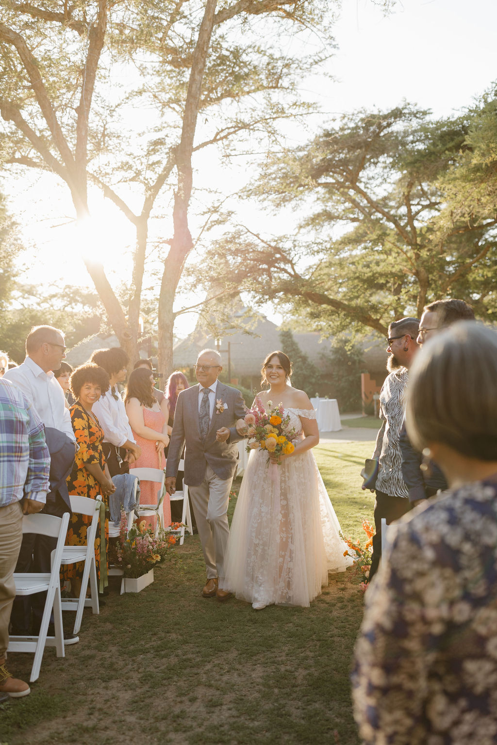 Bride being walked down the aisle by her dad 