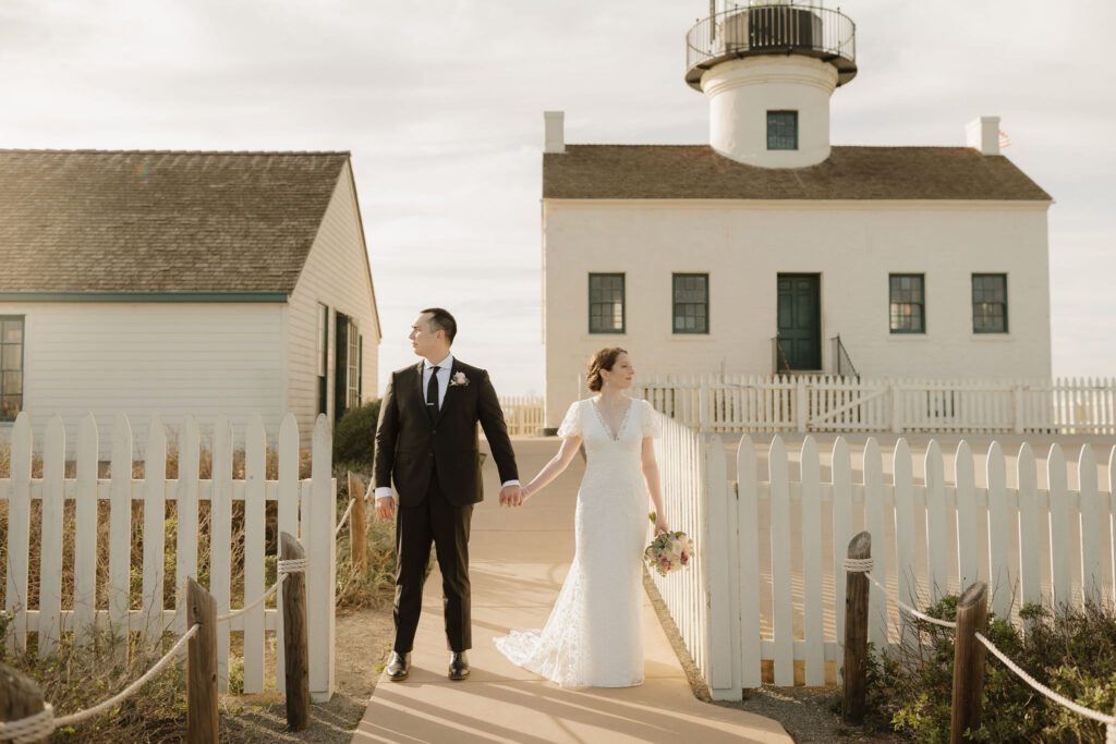 Couple holding hands near Point Loma Lighthouse during Cabrillo National Monument wedding