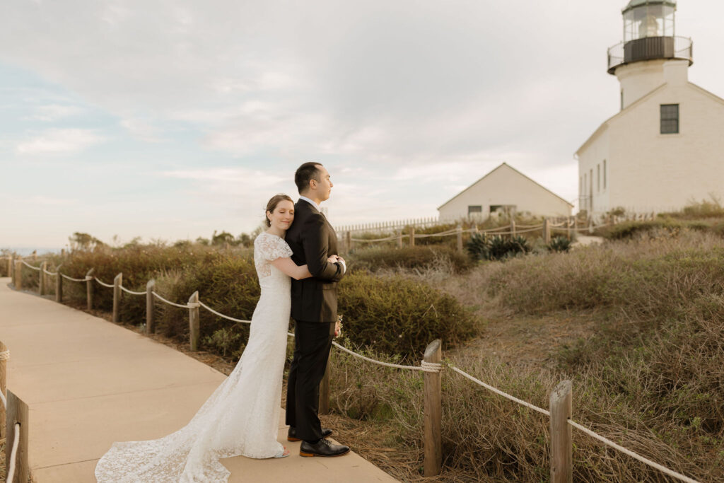 Romantic sunset portrait of couple at Cabrillo National Monument wedding