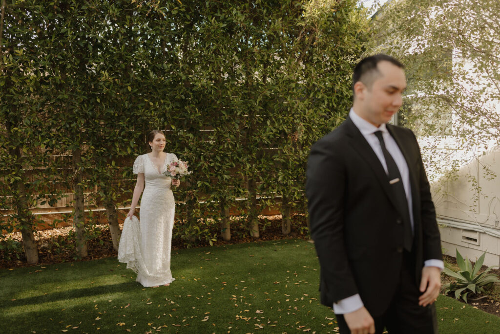 Candid moment of couple's first look before Cabrillo National Monument wedding