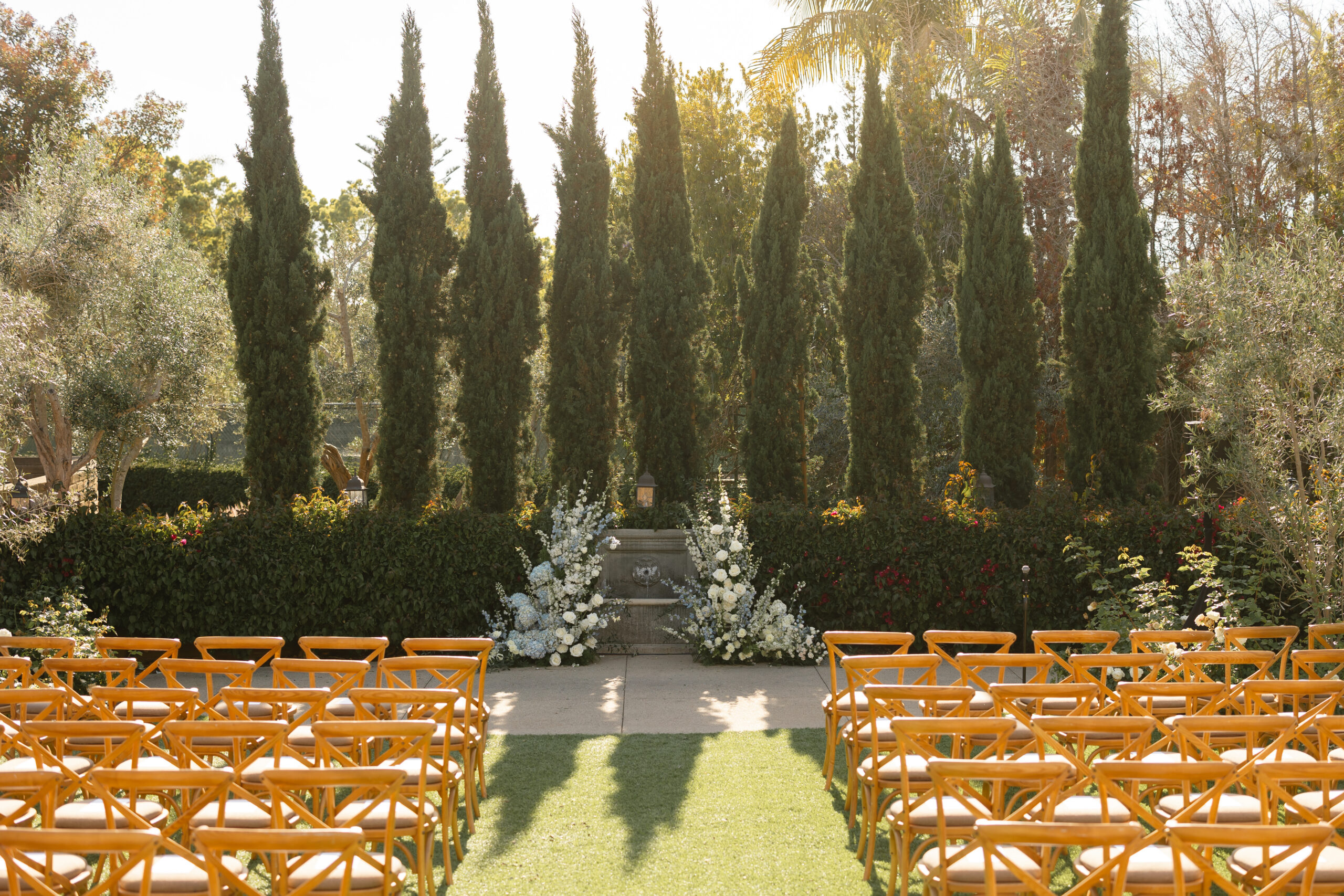 Estancia La Jolla wedding ceremony setup with blue flowers